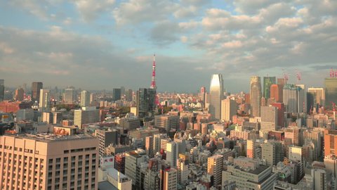 Tokyo, Japan circa-2018. Time lapse shot of clouds moving over city of Tokyo and Tokyo Tower at sunrise.