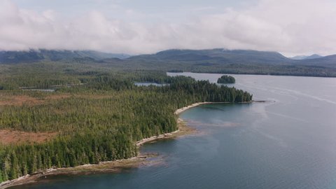 British Columbia circa-2018. Flying over inlets and islands along the British Columbia coast. Shot from helicopter with Cineflex gimbal and RED Epic-W camera.