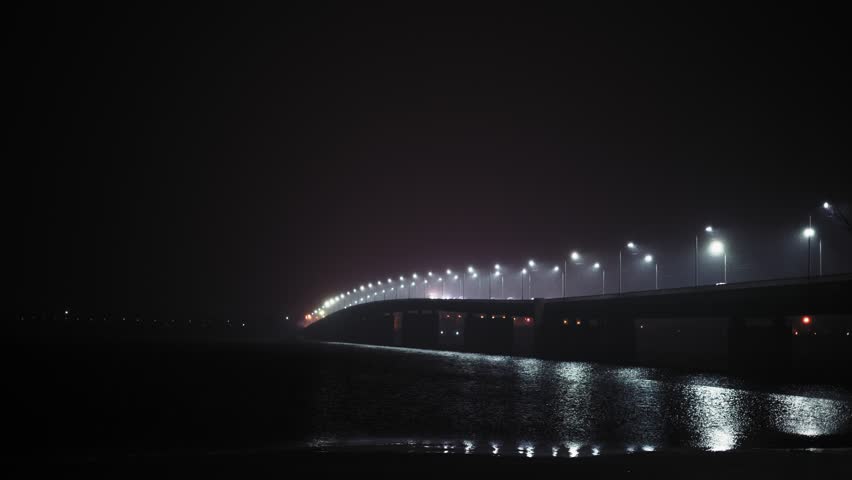 Accelerated Movement, View of the Moving Over Bridge Over Winter River Transport At Night