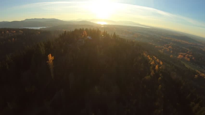Bellingham Washington Aerial Fly Over Mountain Top Real Estate View of City Waterfront Ocean Lake Whatcom Forest Sun Flare