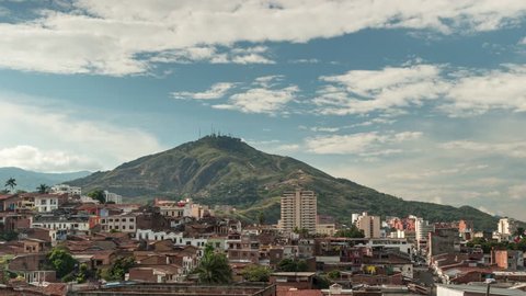 Timelapse of Santiago de Cali, San Antonio district, Valle del Cauca, Colombia. The salsa capital is dominated by the "Cerro de las Tres Cruces" (three cross hill), on a sunny day.