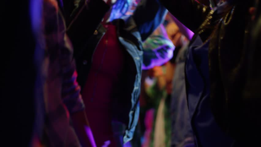 Footage of a crowd or group of young, stylish multi-ethnic people during colorful party in different clothes . Dancers having fun dancing at a party . Shot on RED HELIUM Cinema Camera in slow motion . | Shutterstock HD Video #1022655559