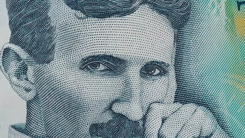 Nikola Tesla portrait on Serbia 100 dinars slow rotating. Genius scientist and inventor. Stock video footage.