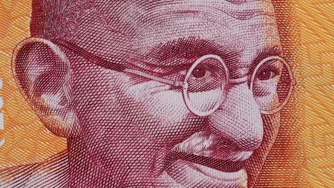 Mahatma Gandhi on India 200 rupee banknote slow rotating. Indian money currency bill. Stock video footage