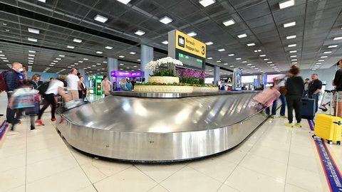 Bangkok, Thailand - January 11, 2019 : Time lapse of baggage conveyor belt in the Suvarnabhumi Airport carrying the passenger luggage