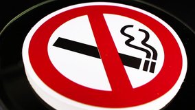 Don t smoke smoking sign symbol on rotating plate seamless looping background