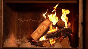 A fire burns in a fireplace slow mo