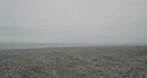 Large gray beach after a rain with a nice seashore capturing video closeup. slow motions . 4k shot on red epic.