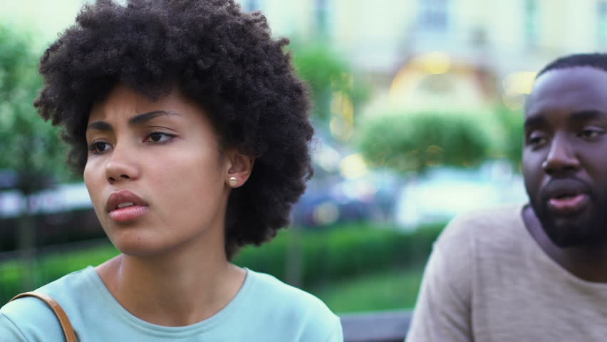 Young afro-american couple arguing outdoors, lies in relationships, breakup Royalty-Free Stock Footage #1022702740
