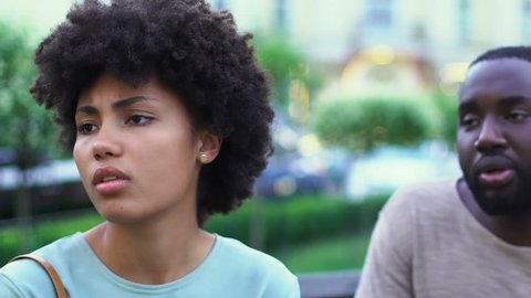 Young afro-american couple arguing outdoors, lies in relationships, breakup