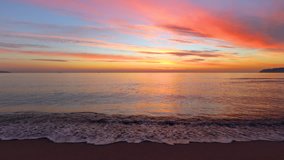 Beautiful cloudscape and tropical beach, video. Sunrise over the sea waves. 