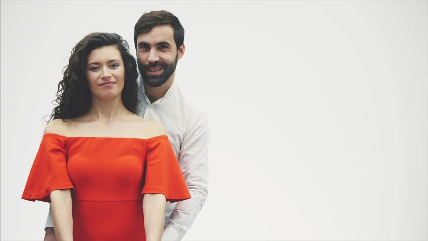 Gentle couple The beauty of the girl and her handsome guy, holding the heart in the form of balloons and kisses. Happy family is joyful. Valentine