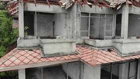 Drone video. Abandoned former hotel building. Phuket island, Thailand. 4K.