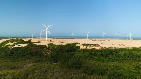 Aerial view of wind turbines on the top of dunes, Brazil.