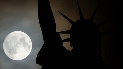 New York: Statue of Liberty at night, Time Lapse with Moon, Clouds and the Iconic Sculpture in Silhouette, Manhattan, USA