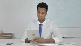 Afro-American Businessman Doing Online Video Chat on Tablet