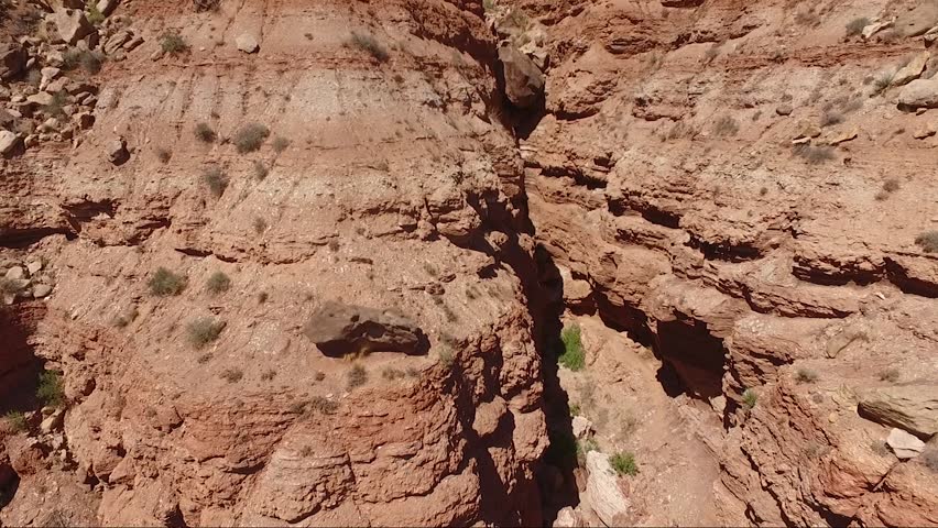 Ascending aerial shot of a canyon in Zion National Park, Utah.