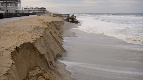 Stormy weather and a violent ocean erodes the sandy beach and dunes away from the Jersey Shore.