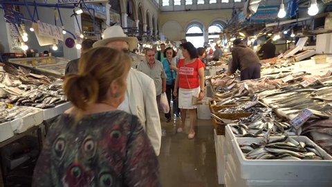 Athens,Greece May 3,2018 - Athens Fish Market.Seafood Stalls with Fishmongers and Shoppers in Central Market in Athens, Greece.