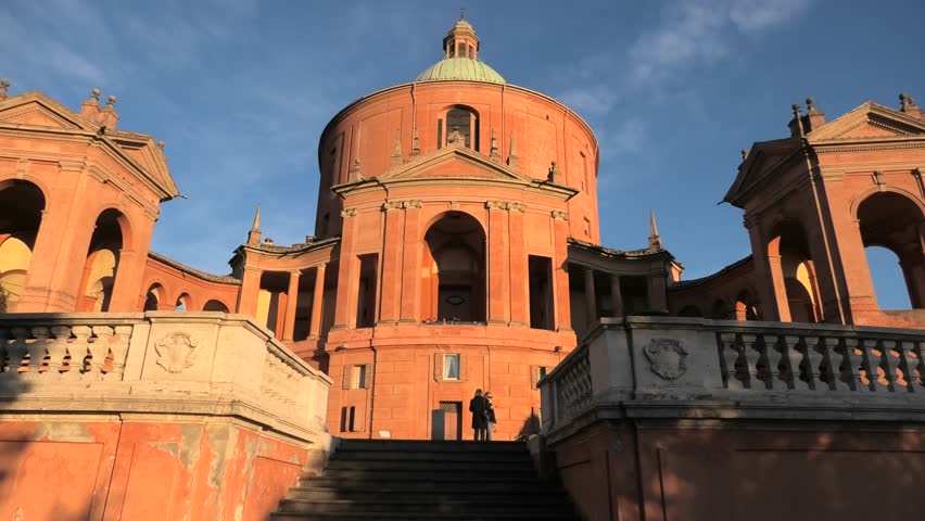 Entrance of Sanctuary of Madonna di San Luca in a sunny day with blue sky. Basilica church of San Luca in Bologna, Emilia-Romagna, Italy. Famous landmark cityscape.