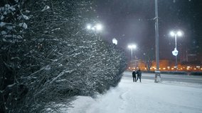 Snowfall in night winter city. Yekaterinburg, Russia. Slow motion. - Powered by Shutterstock - Get 15% off with code: PIKWIZARD15