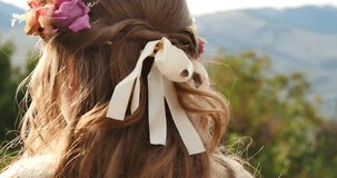 Ribbons in a flower girl's hair