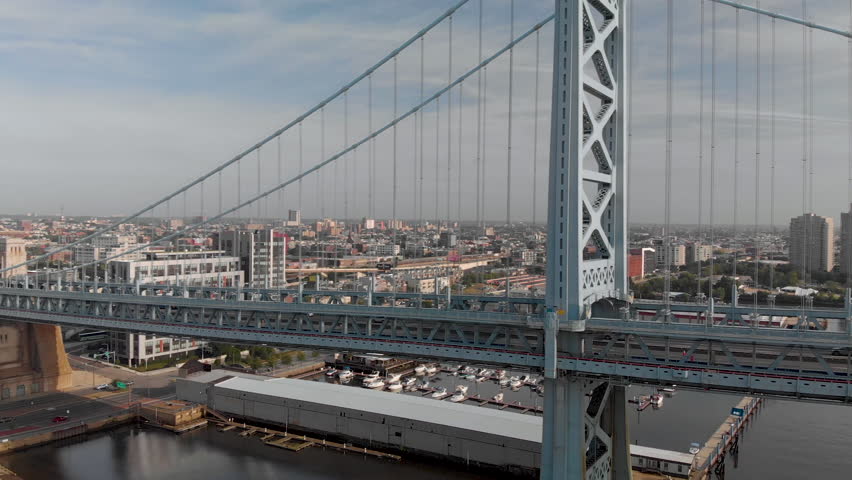 Sunrise aerial drone footage of Benjamin Franklin Bridge in Philadelphia