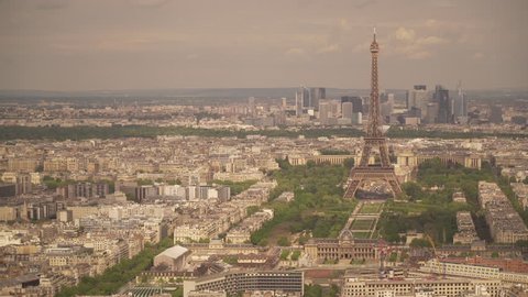 Large view of the city of Paris with the Eiffel Tower and the La Defense district behind, France