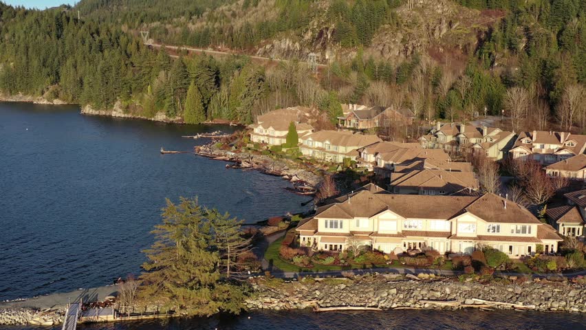 A perfect neighbourhood. Houses in suburb at Summer in the north America. Luxury houses with nice landscape. Aerial drone view. 4K.