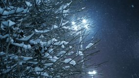 Snow falling on night winter city street. Yekaterinburg, Russia. Slider shot. Slow motion. - Powered by Shutterstock - Get 15% off with code: PIKWIZARD15