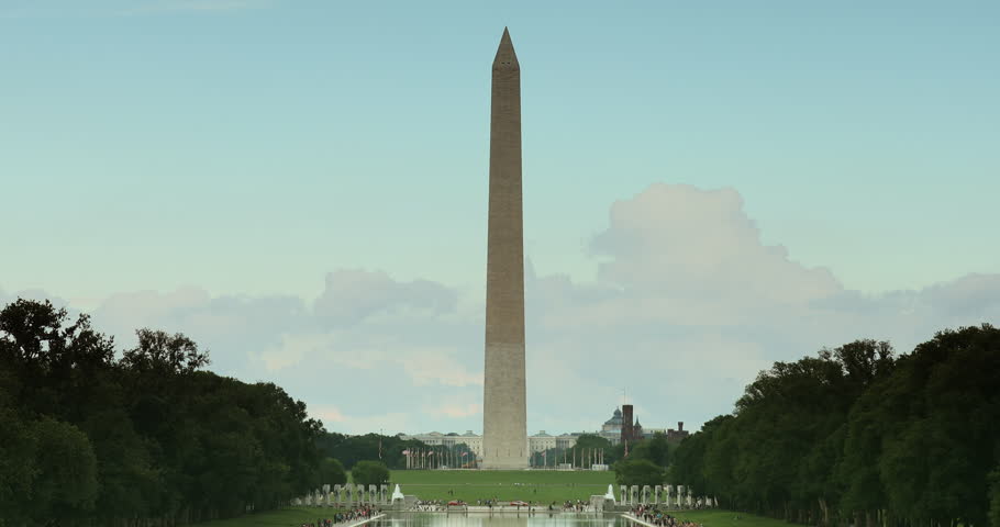 Tourists climb the steps of the Abraham Lincoln Memorial monument on the National Mall in Washington DC USA