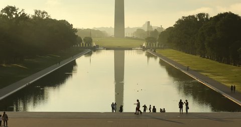 Washington DC Monument and the US Capitol Building across the reflecting pool from the Lincoln Memorial on The National Mall USA