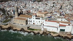 Landscape of picturesque Spanish town of Sitges with church  on Mediterranean seaside 