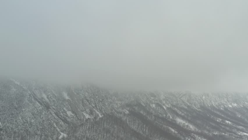 Heavy snow by winter on top of Veliki Krs mountain 4K aerial footage
