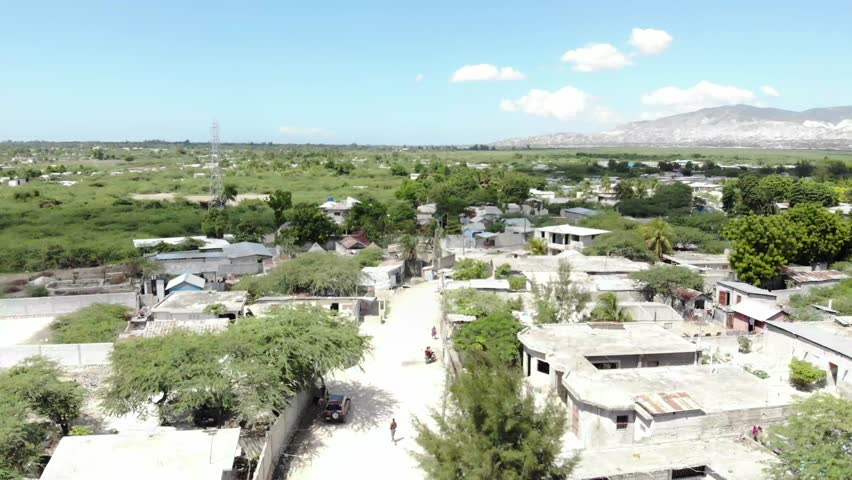 Aerial view of dirt road in island town