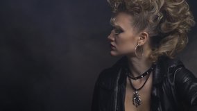 Beautiful blonde rocker woman in leather jacket puts on her sunglasses - Powered by Shutterstock - Get 15% off with code: PIKWIZARD15