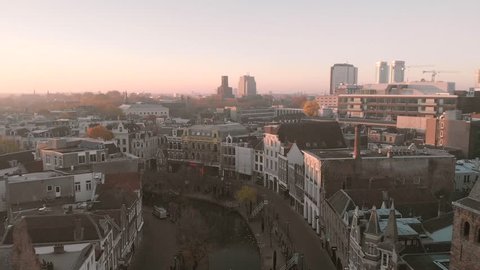Slowly panning forward over the historic city centre of Utrecht in The Netherlands revealing the canal and wharf streets below