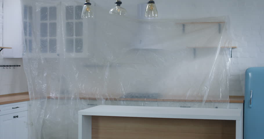 Medium shot of a real estate agent showing and explaining property for sale to a couple