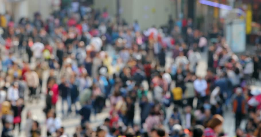 Blur of people walk in the street