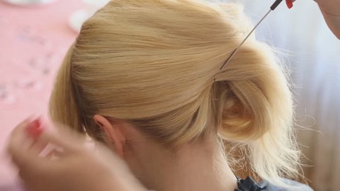 Stylist Making Hair Style to Woman