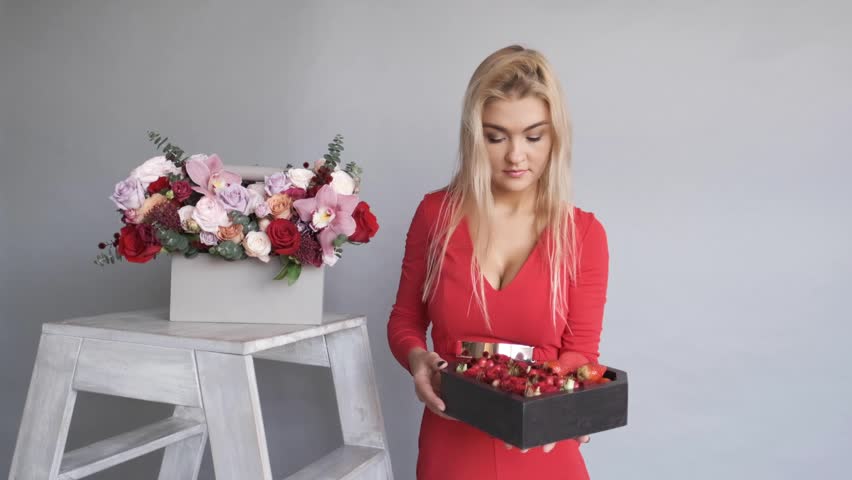 Woman florist holding a bouquet of beautiful flowers