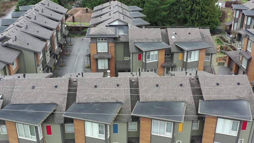 A perfect neighbourhood. Houses in suburb at Summer in the north America. Luxury houses with nice landscape. Aerial drone view. 4K.