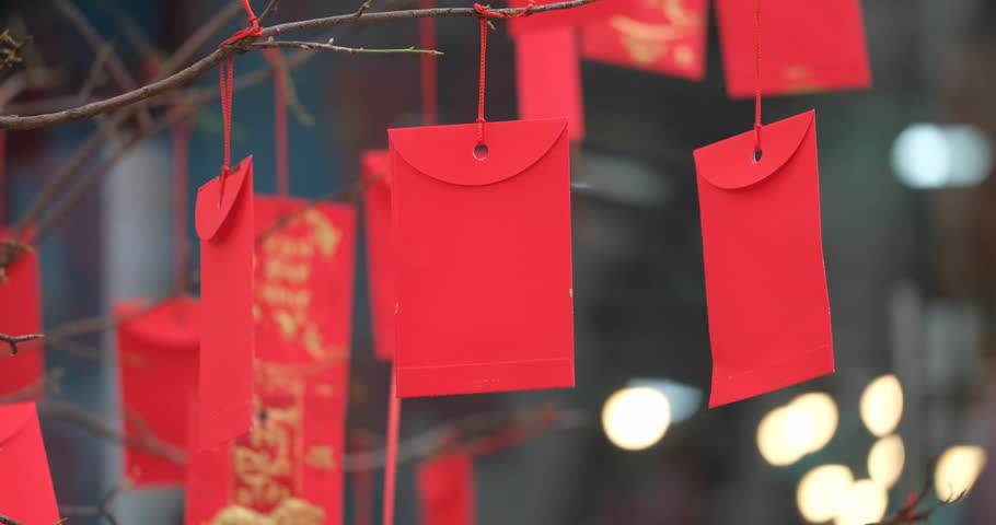 Red envelopes in Lunar New Year. High-quality stock footage of red envelopes Lunar New Year decorated with text "Happy New Year" on red pocket. Chinese New Year or Spring Festival, traditional holiday Royalty-Free Stock Footage #1022892883