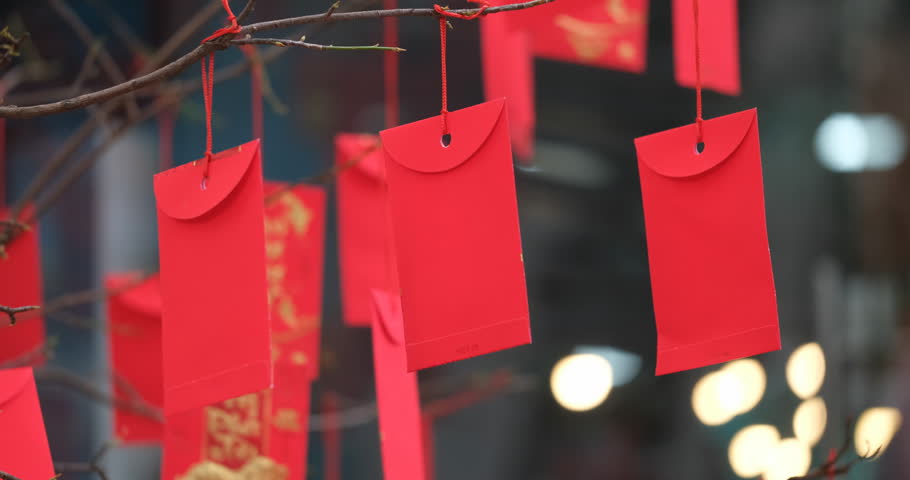 Red envelope in Lunar New Year. High-quality stock footage of red envelopes Lunar New Year decorated with text "Happy New Year" on red pocket. Chinese New Year or Spring Festival, traditional holiday Royalty-Free Stock Footage #1022895046