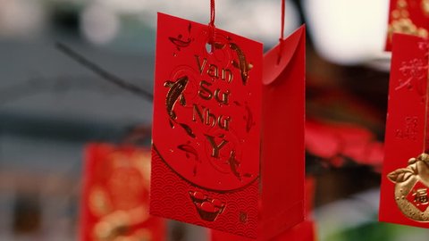 Red envelope in Lunar New Year. High-quality stock footage of red envelopes Lunar New Year decorated with text "Happy New Year" on red pocket. Chinese New Year or Spring Festival, traditional holiday