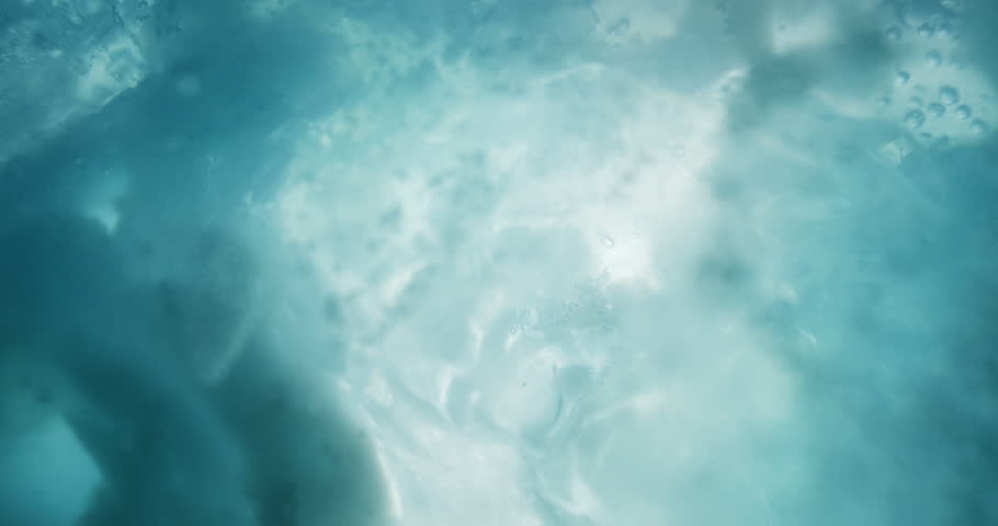 Breathtaking turquoise underwater ice with rising air bubbles. Close up of cold cyan underwater ice. Royalty-Free Stock Footage #1022909743