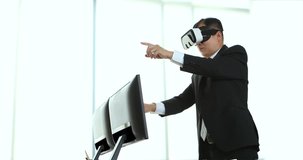 Asian middle-aged businessmen are viewing the contents of the virtual reality device, which is a technology of the future, Helps to make business easier and more successful and moving his hands.
 - Powered by Shutterstock - Get 15% off with code: PIKWIZARD15