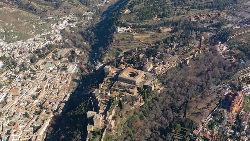 Aerial view of cityscape of Granada, famous historic city, monumental castle/palace complex of Alhambra - landscape panorama of Andalusia from above, Spain, Europe | Shutterstock HD Video #1022911081