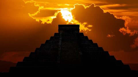 Mayan pyramid ( Kukulcan Temple ) at Sunset, Time Lapse with Red Sun and Clouds, Chichen Itza, Yucatan, Mexico