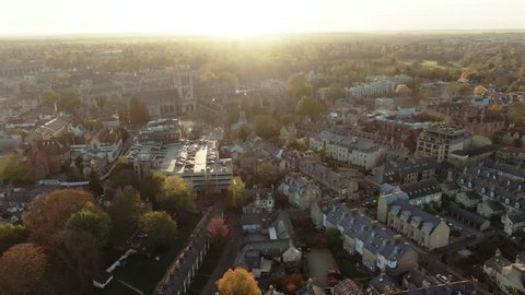 Aerial dolly view of the center of the town of Cambridge (England) before sunset